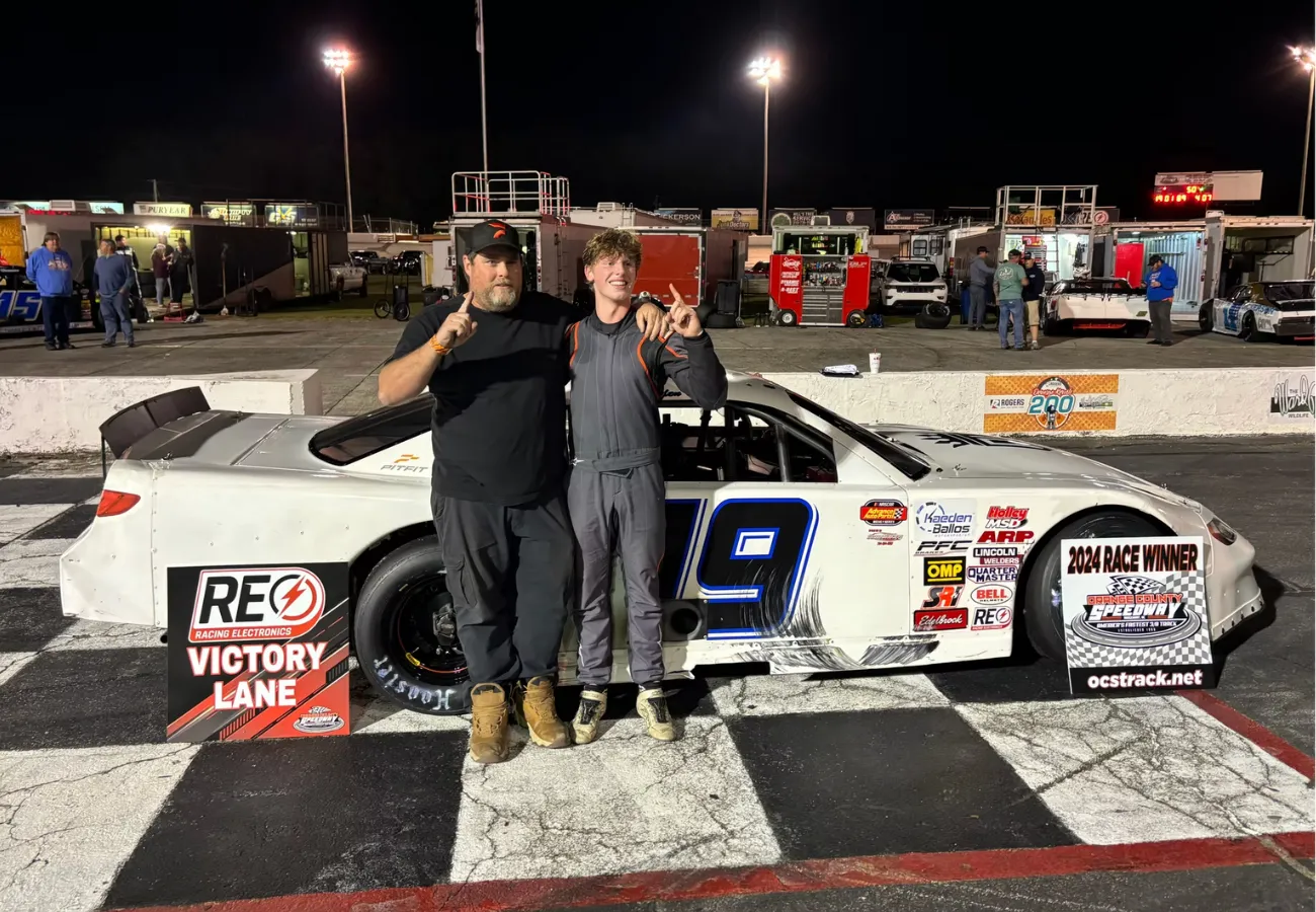 Kaeden Ballos celebrates a Late Model win at Orange County Speedway during Triple 50 night.